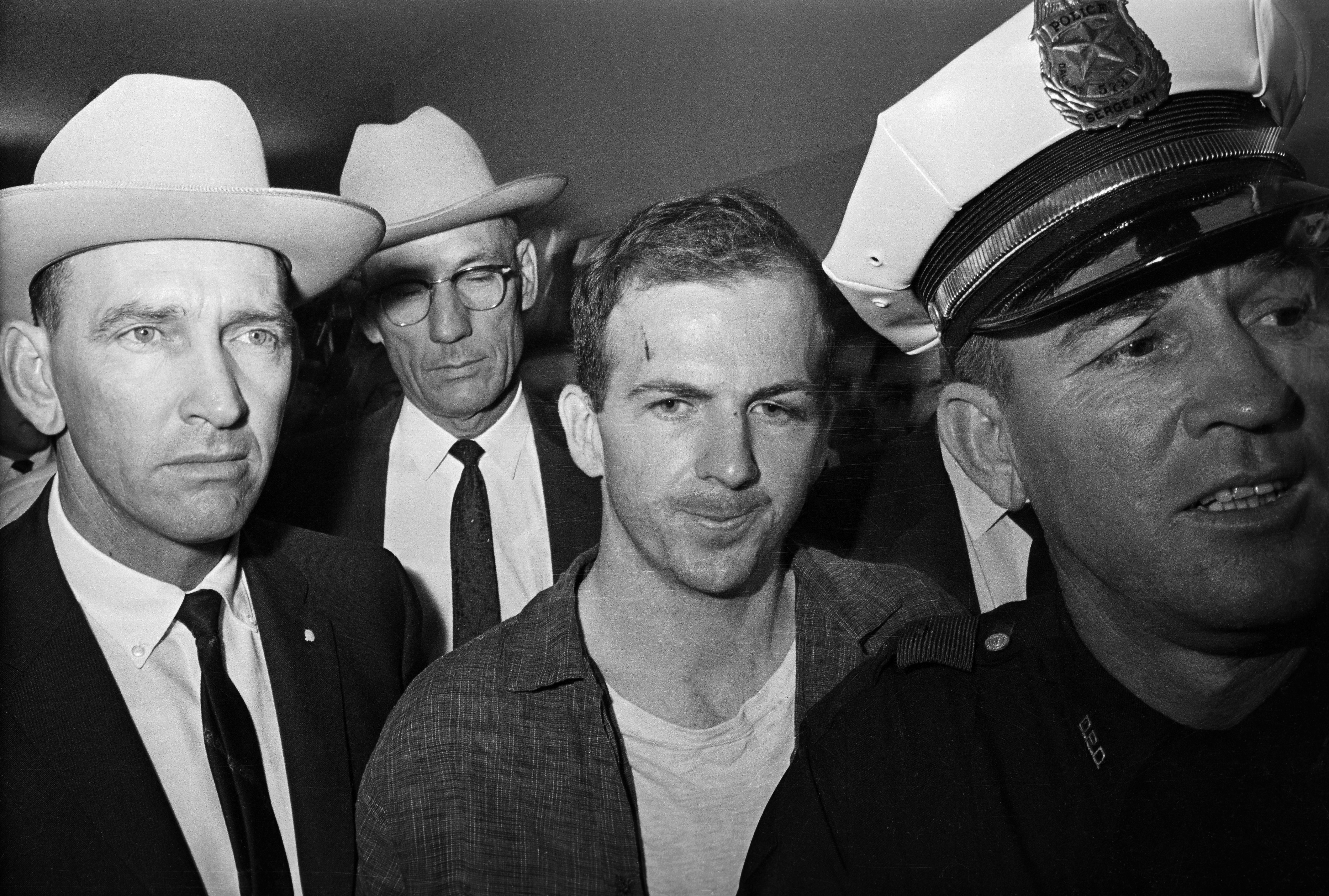 Lee Harvey Oswald Being Led by Policemen